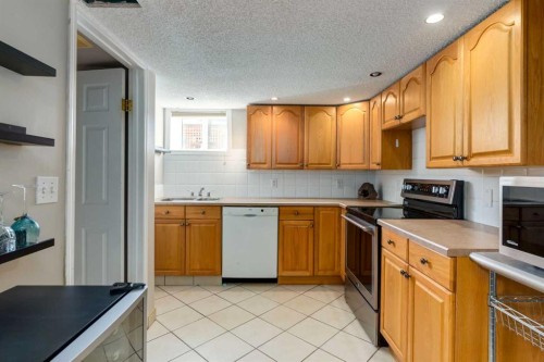 4603 79 Street Nw, Calgary, AB - Indoor Photo Showing Kitchen With Double Sink