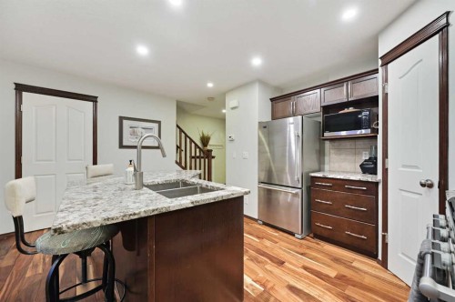 71 Cranberry Place Se, Calgary, AB - Indoor Photo Showing Kitchen With Double Sink