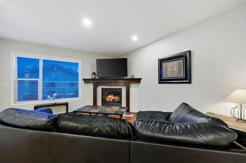 71 Cranberry Place Se, Calgary, AB - Indoor Photo Showing Living Room With Fireplace