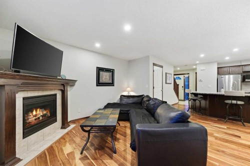 71 Cranberry Place Se, Calgary, AB - Indoor Photo Showing Living Room With Fireplace