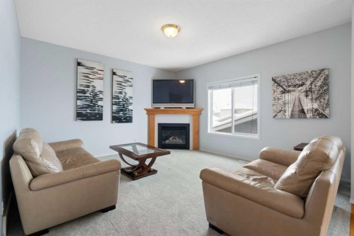 46 Bridleridge Way Sw, Calgary, AB - Indoor Photo Showing Living Room With Fireplace