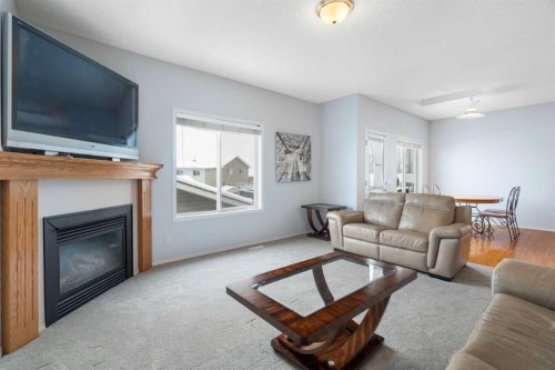 46 Bridleridge Way Sw, Calgary, AB - Indoor Photo Showing Living Room With Fireplace