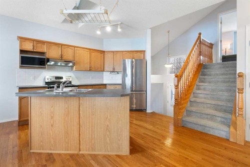 46 Bridleridge Way Sw, Calgary, AB - Indoor Photo Showing Kitchen With Double Sink