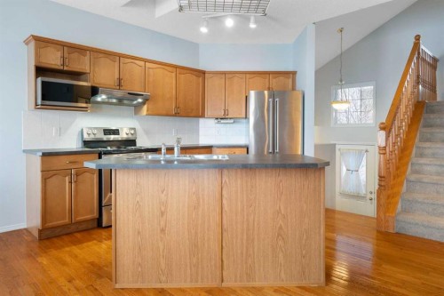 46 Bridleridge Way Sw, Calgary, AB - Indoor Photo Showing Kitchen With Double Sink