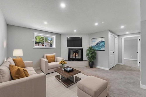 992 Rundlecairn Way Ne, Calgary, AB - Indoor Photo Showing Living Room With Fireplace