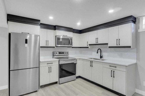 992 Rundlecairn Way Ne, Calgary, AB - Indoor Photo Showing Kitchen With Stainless Steel Kitchen With Double Sink