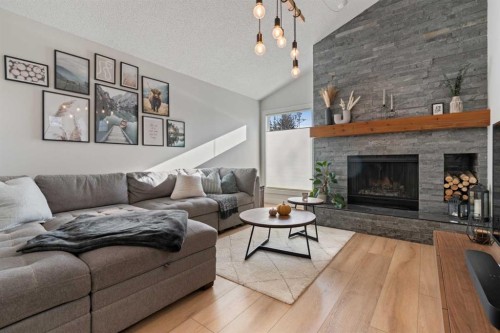 7132 36 Avenue Nw, Calgary, AB - Indoor Photo Showing Living Room With Fireplace