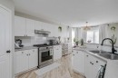 67 Silver Springs Way Nw, Airdrie, AB  - Indoor Photo Showing Kitchen With Double Sink 