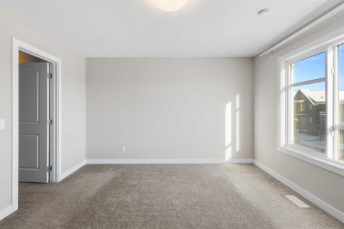 13 Howse Row Ne, Calgary, AB - Indoor Photo Showing Other Room
