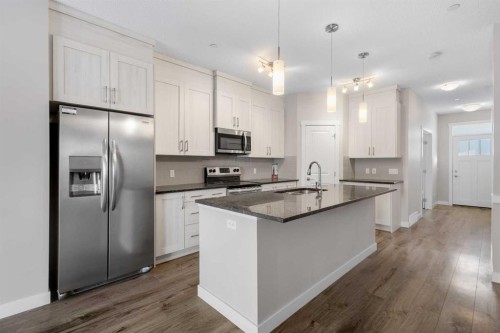 13 Howse Row Ne, Calgary, AB - Indoor Photo Showing Kitchen With Stainless Steel Kitchen With Upgraded Kitchen