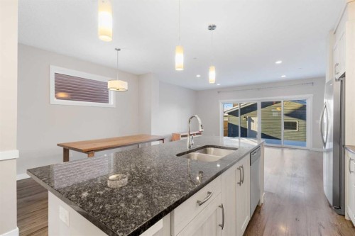 13 Howse Row Ne, Calgary, AB - Indoor Photo Showing Kitchen With Double Sink With Upgraded Kitchen