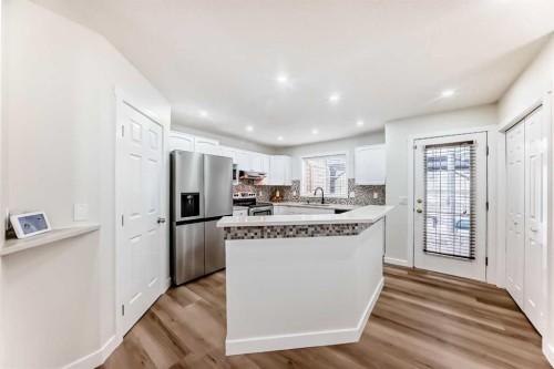170 Country Hills Heights, Calgary, AB - Indoor Photo Showing Kitchen With Upgraded Kitchen