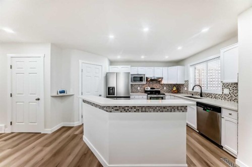 170 Country Hills Heights, Calgary, AB - Indoor Photo Showing Kitchen With Upgraded Kitchen