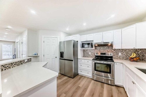 170 Country Hills Heights, Calgary, AB - Indoor Photo Showing Kitchen With Upgraded Kitchen