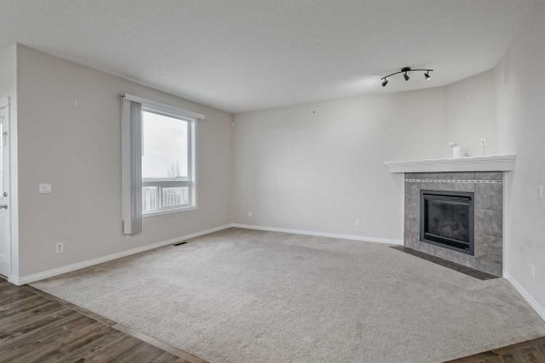 206 Pantego View Nw, Calgary, AB - Indoor With Fireplace