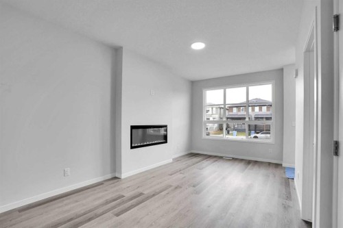 1905 Cornerstone Boulevard Ne, Calgary, AB - Indoor Photo Showing Living Room With Fireplace