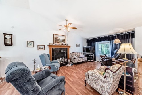 21 Strathmore Lakes Way, Strathmore, AB - Indoor Photo Showing Living Room With Fireplace