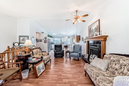 21 Strathmore Lakes Way, Strathmore, AB - Indoor Photo Showing Living Room With Fireplace