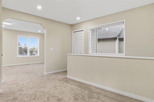 64 Cougarstone Square Sw, Calgary, AB - Indoor Photo Showing Other Room