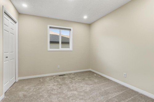 64 Cougarstone Square Sw, Calgary, AB - Indoor Photo Showing Other Room