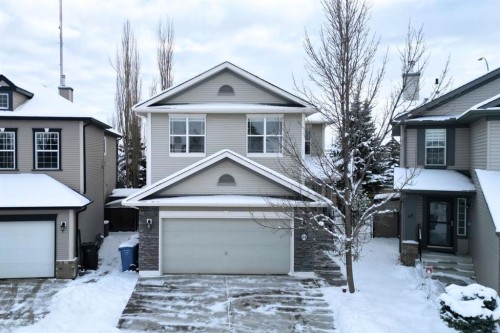 64 Cougarstone Square Sw, Calgary, AB - Outdoor With Facade