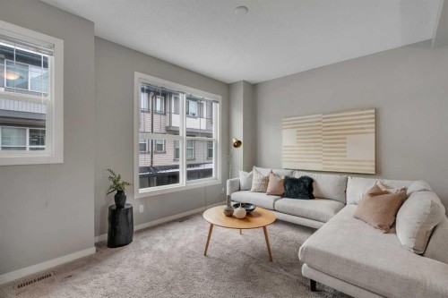 34 New Brighton Point Se, Calgary, AB - Indoor Photo Showing Living Room