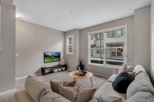 34 New Brighton Point Se, Calgary, AB - Indoor Photo Showing Living Room