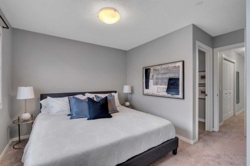 34 New Brighton Point Se, Calgary, AB - Indoor Photo Showing Bedroom
