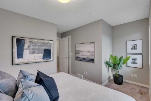 34 New Brighton Point Se, Calgary, AB - Indoor Photo Showing Bedroom