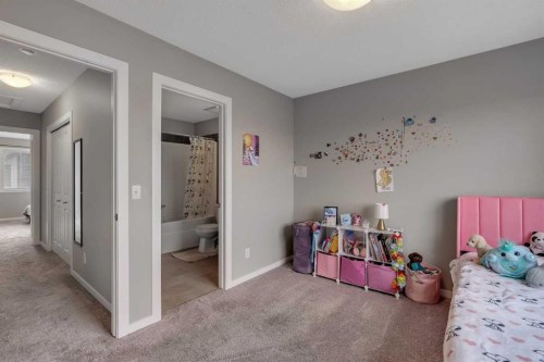 34 New Brighton Point Se, Calgary, AB - Indoor Photo Showing Bedroom