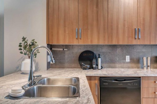 34 New Brighton Point Se, Calgary, AB - Indoor Photo Showing Kitchen With Double Sink