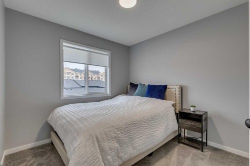 63 Wolf Gate, Okotoks, AB - Indoor Photo Showing Bedroom