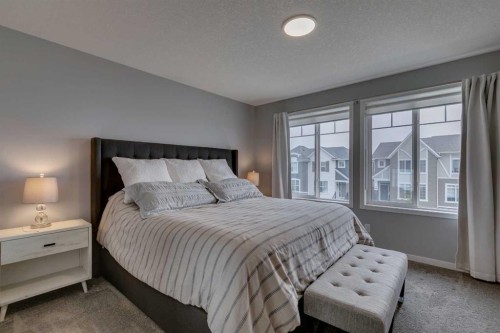 63 Wolf Gate, Okotoks, AB - Indoor Photo Showing Bedroom