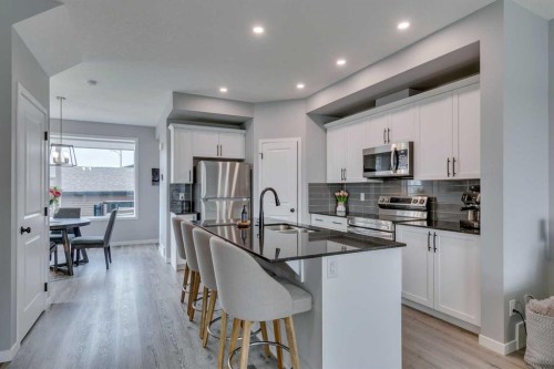 63 Wolf Gate, Okotoks, AB - Indoor Photo Showing Kitchen With Upgraded Kitchen