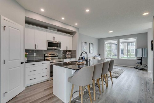 63 Wolf Gate, Okotoks, AB - Indoor Photo Showing Kitchen With Upgraded Kitchen