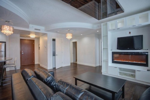 N/A-201 1 Street Se, Calgary, AB - Indoor Photo Showing Living Room With Fireplace