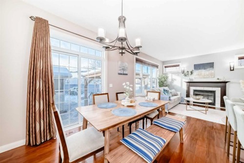297 Evanspark Gardens Nw, Calgary, AB - Indoor Photo Showing Dining Room With Fireplace