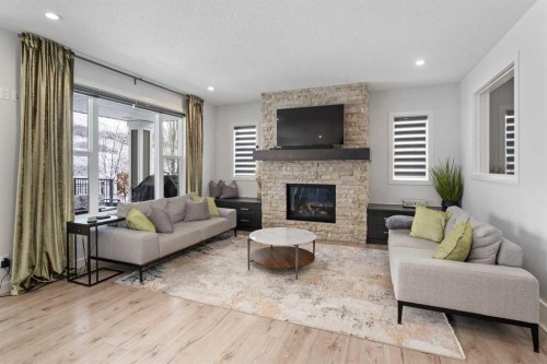 81 Cranbrook Place Se, Calgary, AB - Indoor Photo Showing Living Room With Fireplace