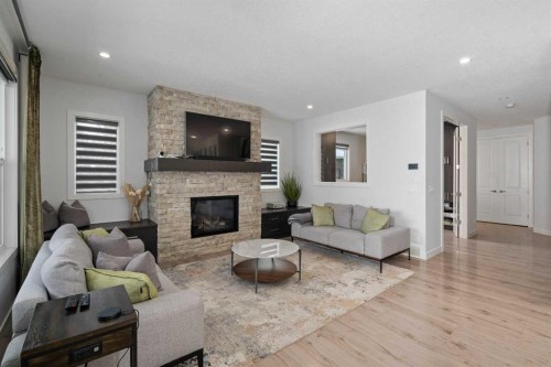 81 Cranbrook Place Se, Calgary, AB - Indoor Photo Showing Living Room With Fireplace