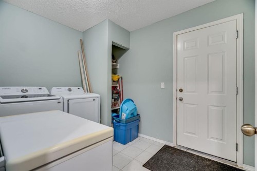 104 Cove Crescent, Chestermere, AB - Indoor Photo Showing Laundry Room