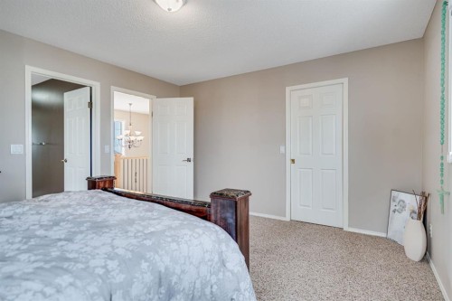 104 Cove Crescent, Chestermere, AB - Indoor Photo Showing Bedroom