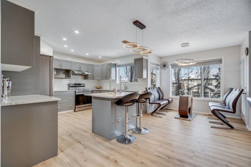 104 Cove Crescent, Chestermere, AB - Indoor Photo Showing Kitchen With Upgraded Kitchen