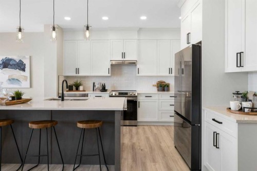 486 Kinniburgh Loop, Chestermere, AB - Indoor Photo Showing Kitchen With Upgraded Kitchen