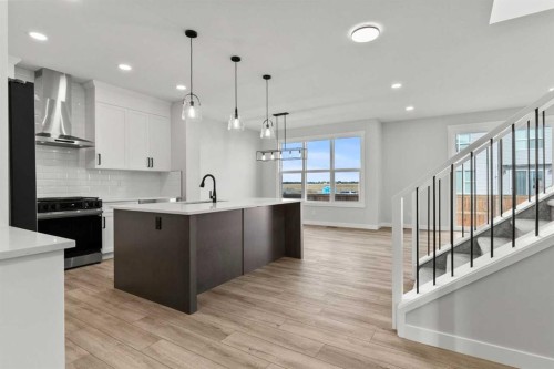 315 Kinniburgh Loop, Chestermere, AB - Indoor Photo Showing Kitchen With Upgraded Kitchen