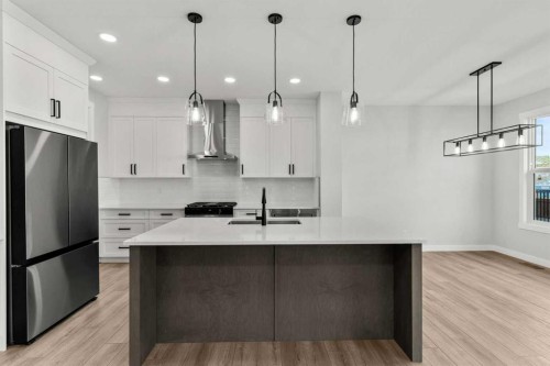315 Kinniburgh Loop, Chestermere, AB - Indoor Photo Showing Kitchen With Upgraded Kitchen