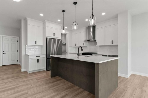 315 Kinniburgh Loop, Chestermere, AB - Indoor Photo Showing Kitchen With Upgraded Kitchen