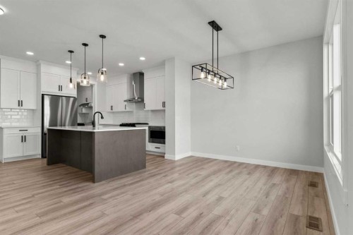 315 Kinniburgh Loop, Chestermere, AB - Indoor Photo Showing Kitchen With Upgraded Kitchen