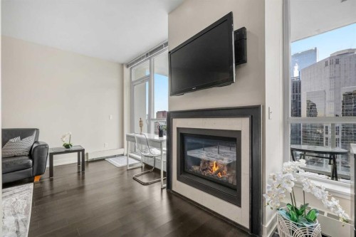 1526-222 Riverfront Avenue Sw, Calgary, AB - Indoor Photo Showing Living Room With Fireplace