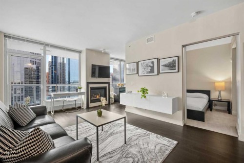 1526-222 Riverfront Avenue Sw, Calgary, AB - Indoor Photo Showing Living Room With Fireplace