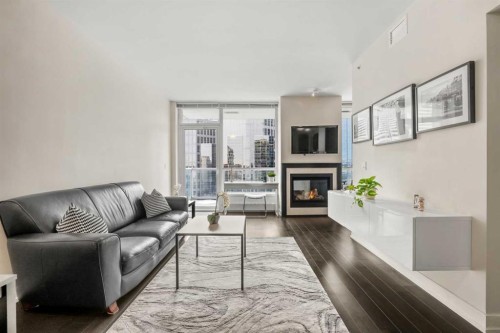 1526-222 Riverfront Avenue Sw, Calgary, AB - Indoor Photo Showing Living Room With Fireplace